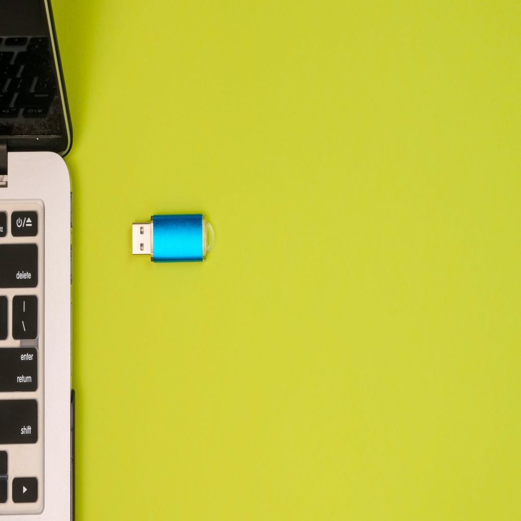 a blue and silver universal serial bus on yellow surface